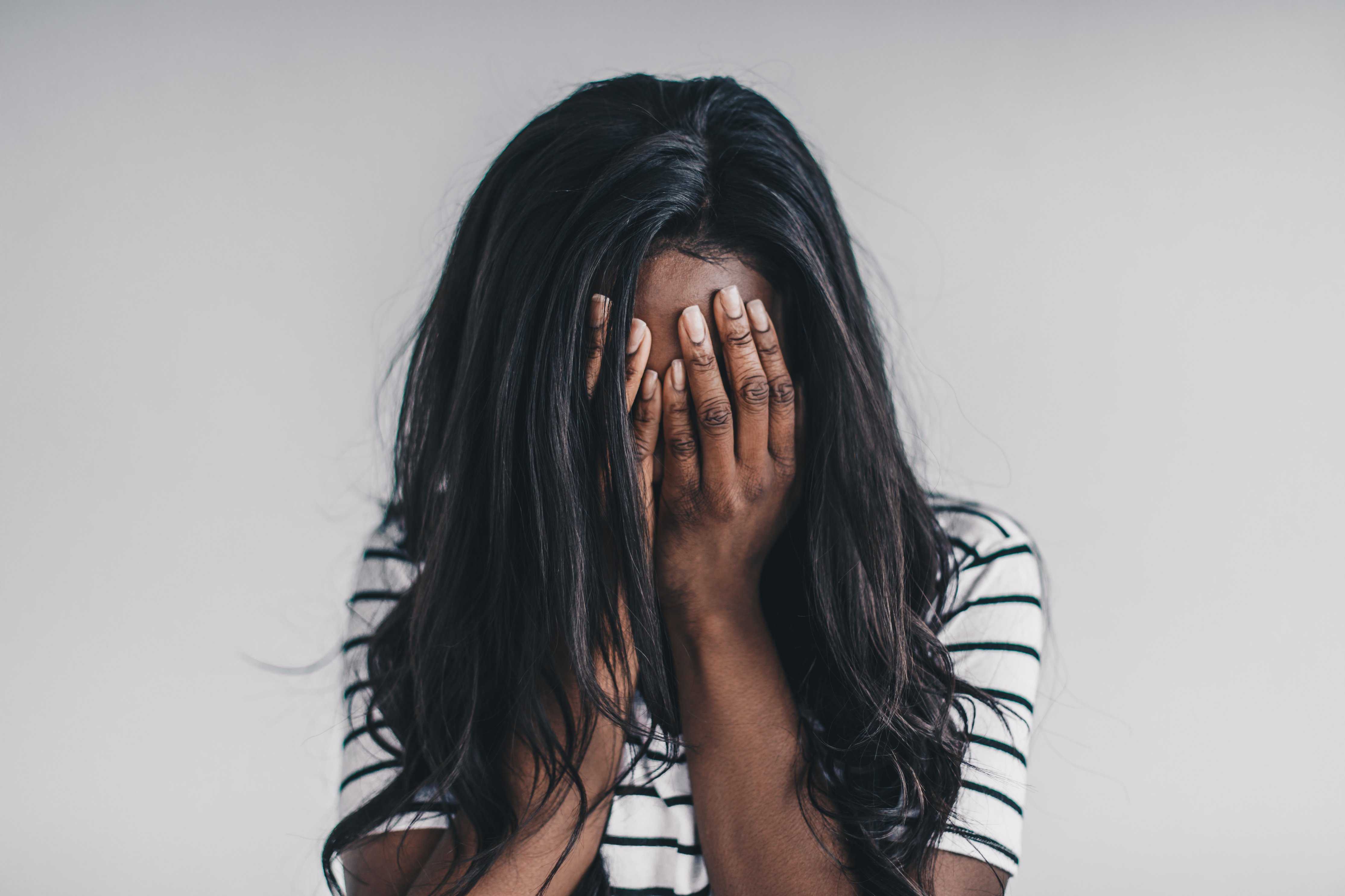 Woman with her head in her hands