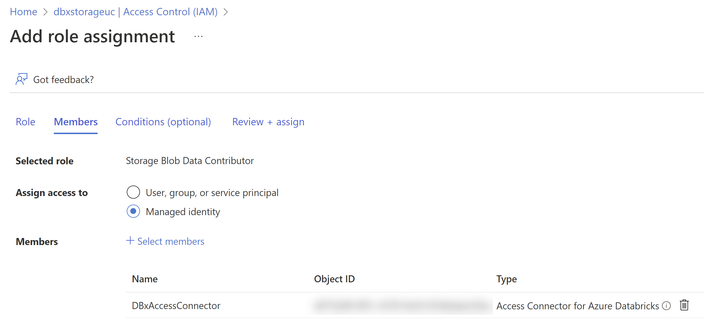 The Add role assignment page for Access Control on the storage account. The selected role is Storage Blob Data Contributor. Assign access to is set to Managed Identity. The member listed is DBxAccessConnector, which is the access connector for Azure Databricks.